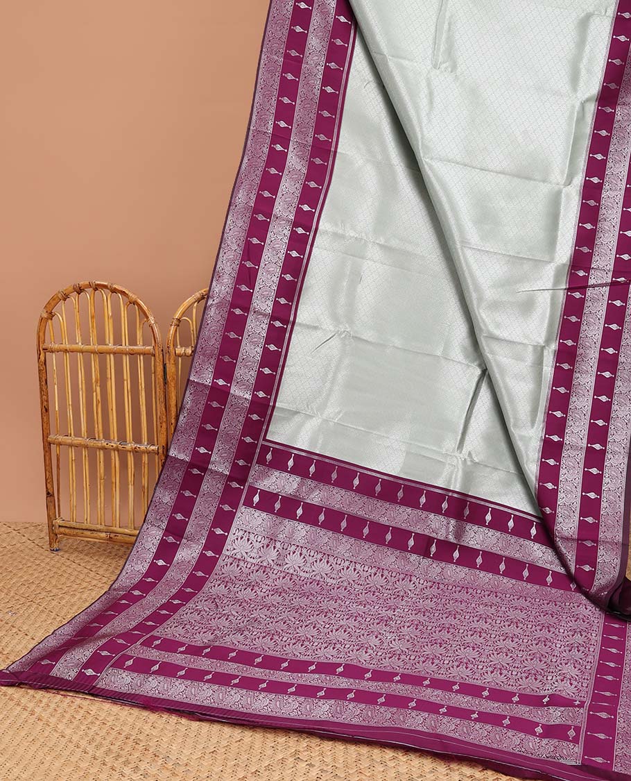 Mint green floral jacquard litchi silk saree with contrast zari design border & checked floral design pallu