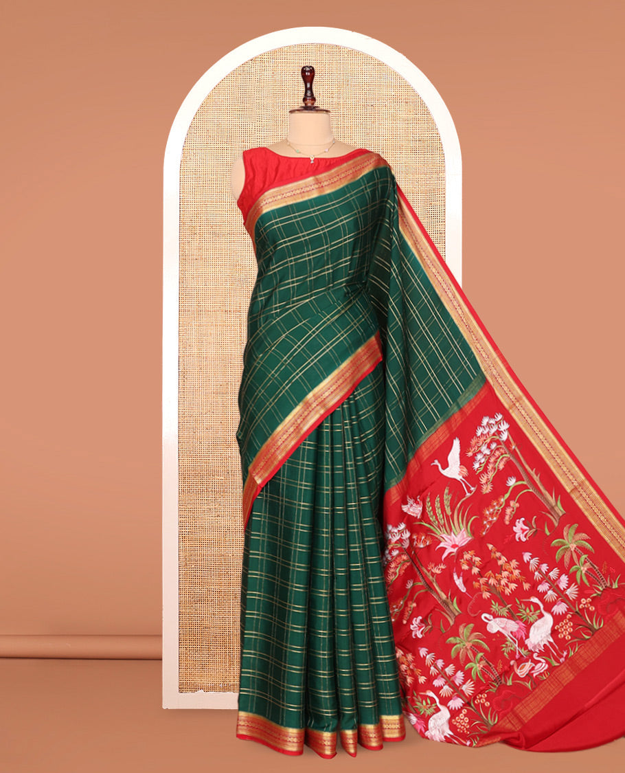 Green Mysore Silk Saree, Gleamed up with Zari Checked Design on its Body, Complemented by Captivating Contrast Border of Traditional Zari Designs, Pallu of Tropical Flora and Flamingo Bird Designs, and Paired with a Contrast Blouse