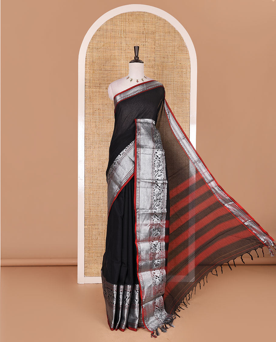 Black plain mercerised cotton saree, contrast traditional zari border of elephant and peacock designs, striped pallu, and plain blouse