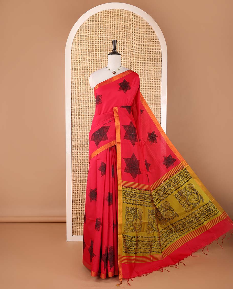 Red six-petal-like leaf motifs printed micro-silk saree, copper zari border, contrast intricate pallu & plain green blouse