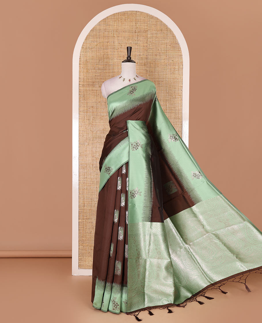 Brown-green floral buttas elite soft silk saree, contrast floral buttas border, and pallu of Mughal-style intricate zari designs