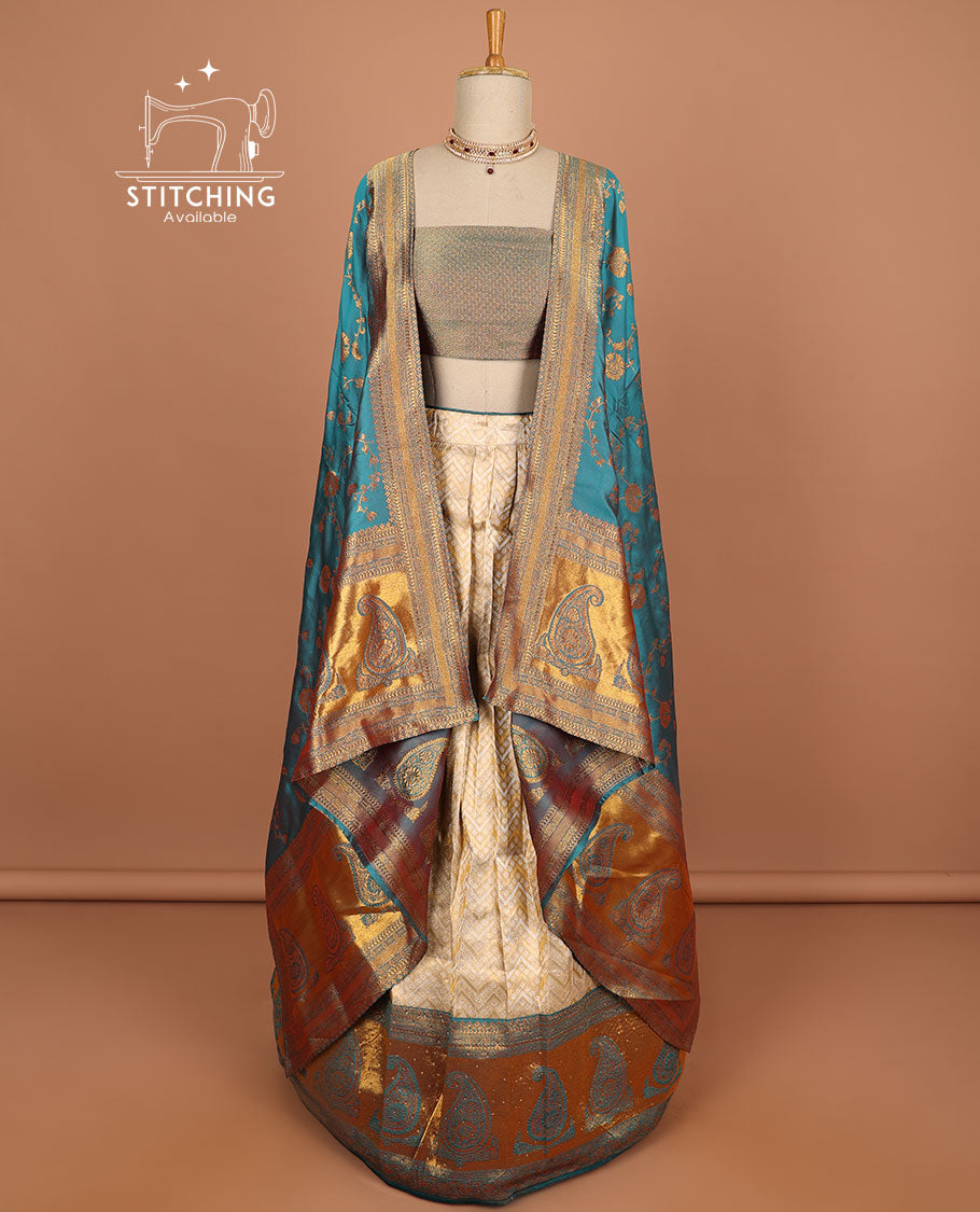 Cream geometric design half saree with contrast zari border, zari design blouse & blue floral zari design dhavani