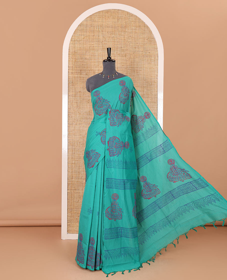 Borderless Blue kolam and kathakali motifs printed South cotton saree with a matching blouse, and a contrast floral motifs printed blouse