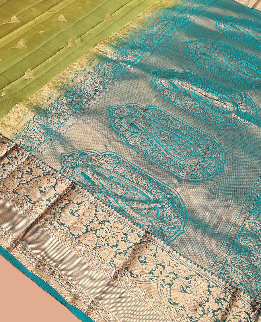Green zari buttas Vasundhara silk mix saree, contrast border of thilakam mokku, muthu, mayil, laddu kamalam, and kuyil kann designs, and pallu of paisleys