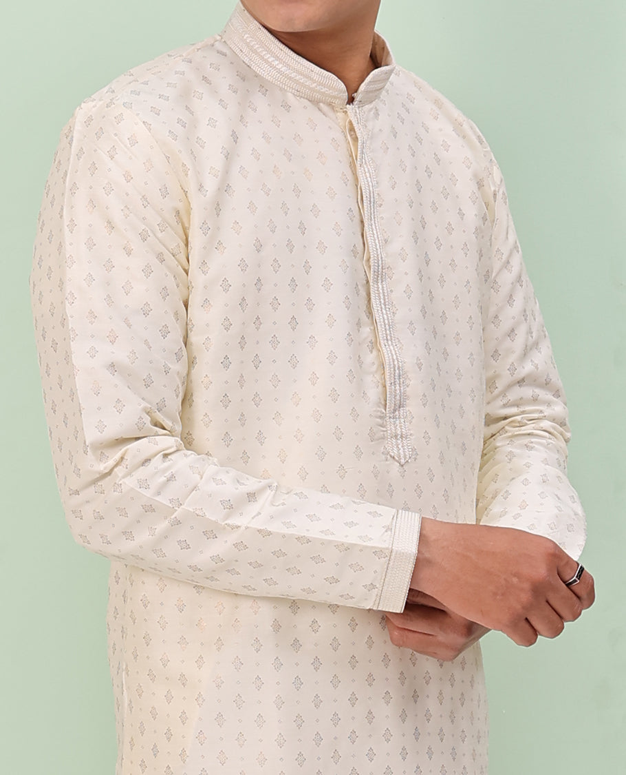 Light cream antique golden color buttas, and neck embroidered full-sleeved readymade kurta