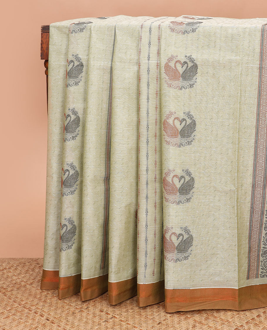 Pale green buttas and striped coimbatore cotton saree, contrast plain border and pallu of Swan motifs