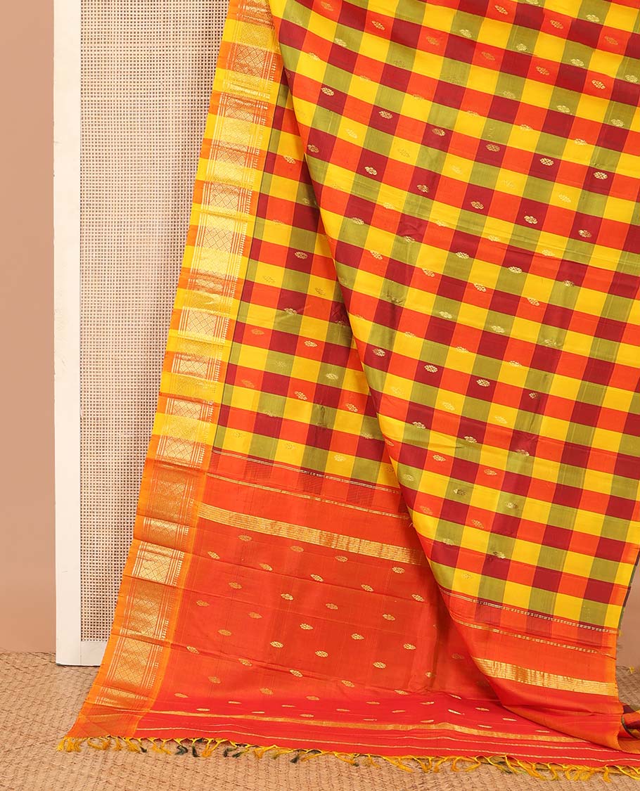 Multi-color checked and zari buttas Kanchipuram silk saree, one-sided border of paneer sombu, banaras, muthu, and jaal designs, and zari design pallu