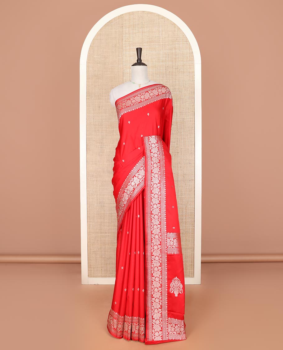 Red zari buttas mushru silk saree, self-border of floral creeper designs, and flower vase buttas woven pallu
