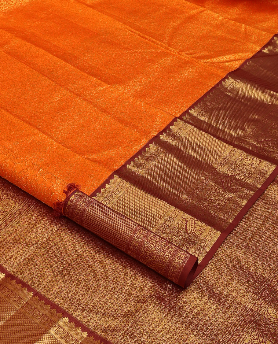 Orange jacquard wedding silk saree, contrast traditional zari design border, and zari-rich jaal pallu