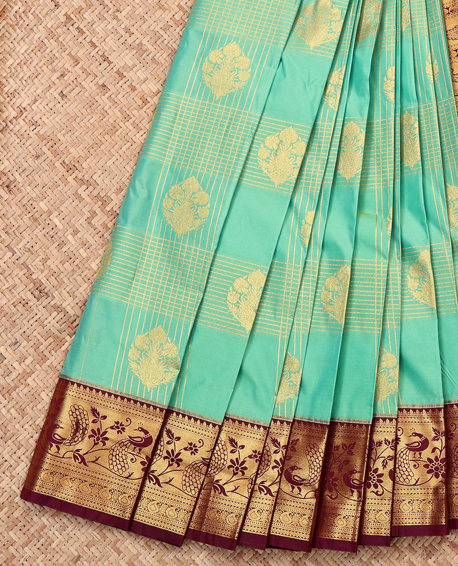 Turquoise Budget Silk Saree, Gracefully Embellished with Zari Butta Enclosed Checks, a Contrast Traditional Zari Border, Intricate Pallu, and a Contrast Blouse