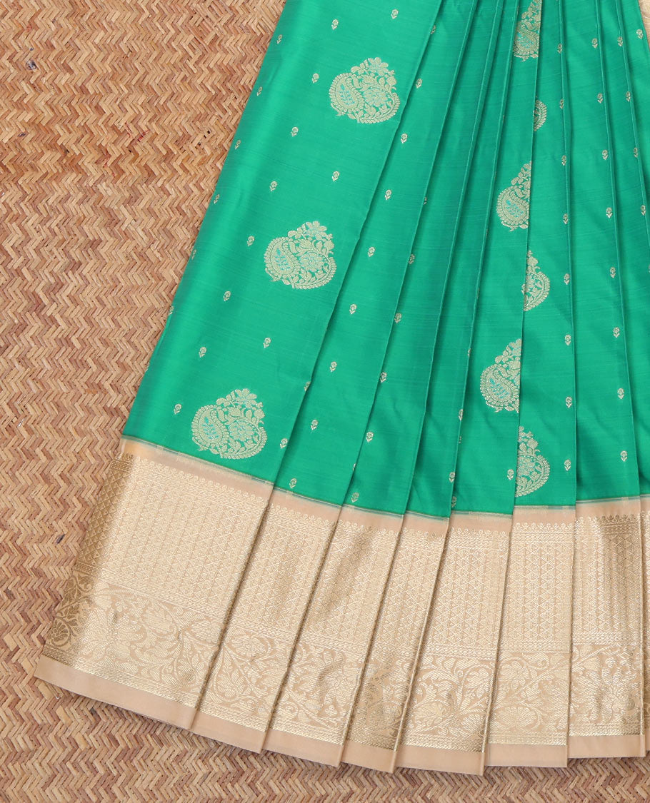 Green Budget Silk Saree, Detailed with Zari Buttas All Over Its Body, Complemented by a Contrast Traditional Zari Border, Pallu of Jaal and Paisleys, and Paired with a Contrast Blouse