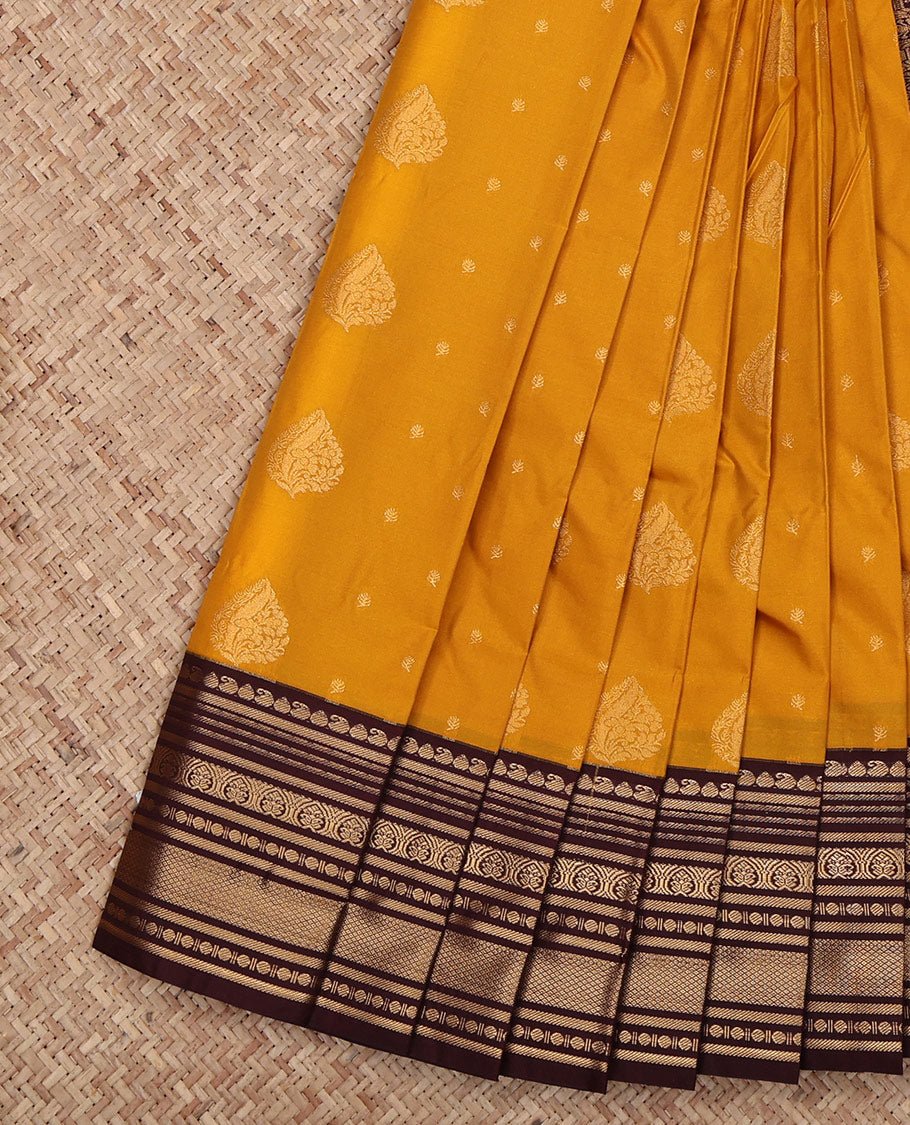 Yellow Budget Silk Saree, Spotlighted with Zari Buttas All Over Its Body, Complemented by a Contrast Traditional Zari Design Border, Grand Pallu, and Paired with a Contrast Blouse