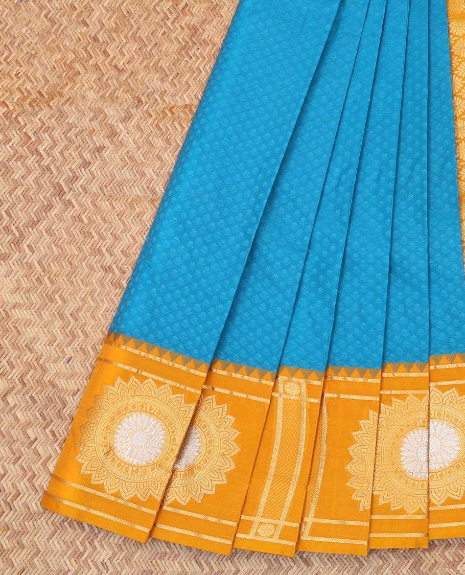 Blue Embossed Budget Silk Saree, Complemented by Contrast Floral Buttas Zari Border, a Grand Jaal Pallu and a Contrast Blouse