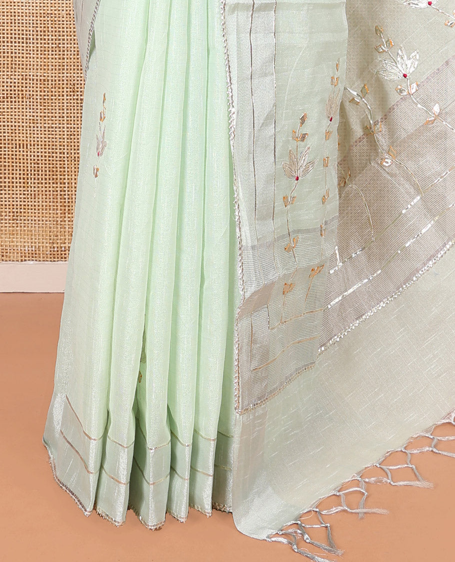 Green Tissue Cotton Saree, Bedecked with Floral Motifs Embroidery on Its Body, Subtle Gota Patti Striped Lace Border, Pallu Elevated with Floral Motifs Embroidery, and Paired with a Matching Blouse