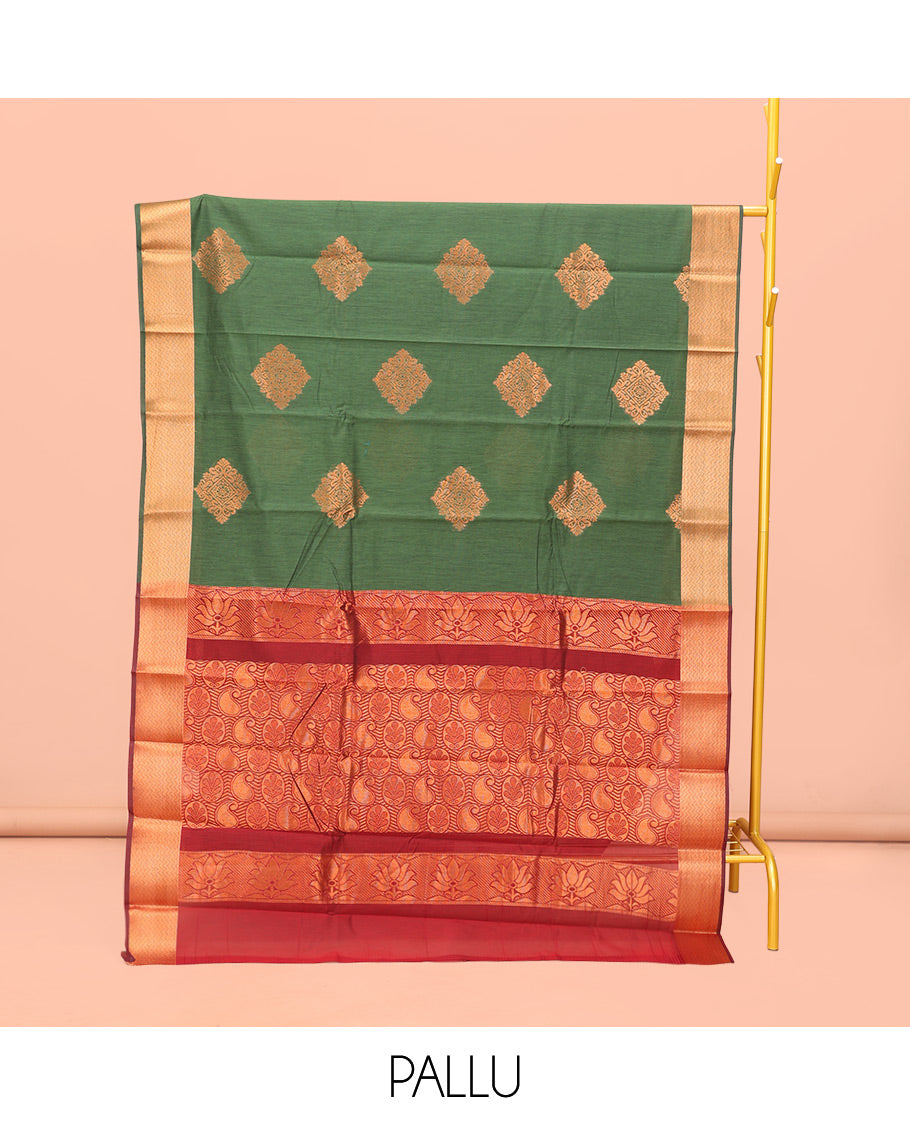 Green Semi-Silk Cotton Saree, Crafted with Zari Buttas All Over Its Body, Highlighted by a Self-Border of Traditional Zari Designs, Pallu Steeped with Paisley Designs, and Paired with a Contrast Blouse