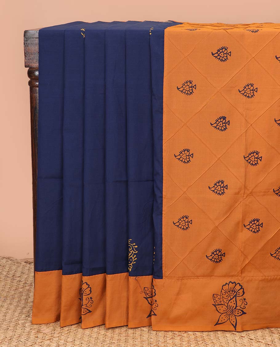 Navy blue block printed buttas poly cotton saree, contrast floral printed border, and pallu of butta enclosed jaal design