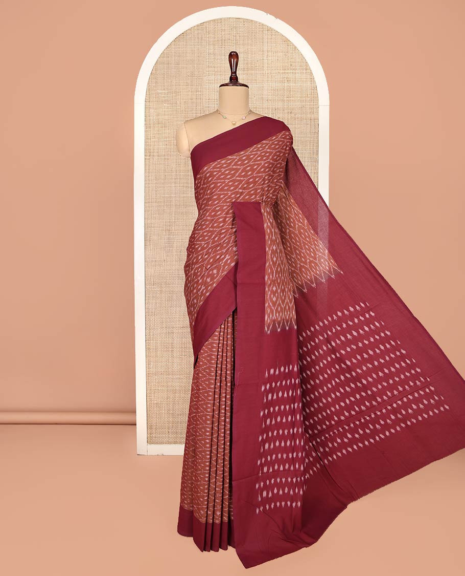 Brown Ikkat Cotton Saree, Steeped with Ikkat-Style Ogee Patterns on Its Body, Complemented by Contrast Border, Pallu Steeped with Ikkat Buttas, and Has No Blouse