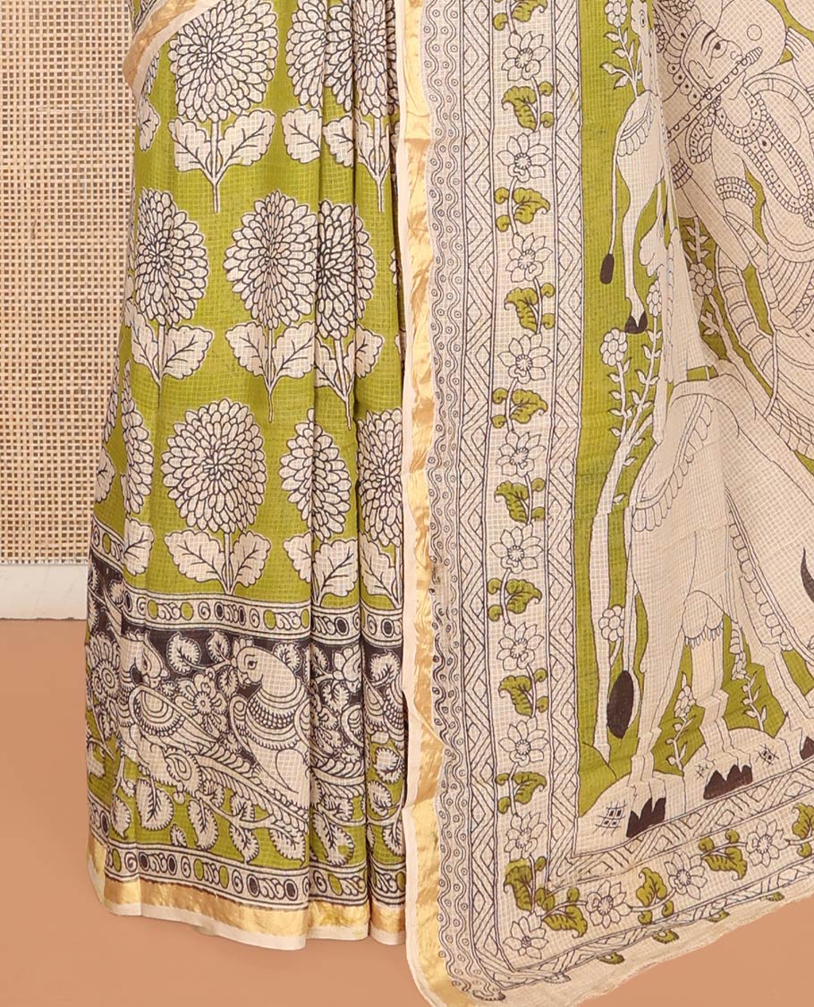 Green Machine-Printed Kalamkari Cotton Saree Features Floral Motifs, a Piping Border, Pallu of Lord Krishna Motifs, and a Matching Blouse