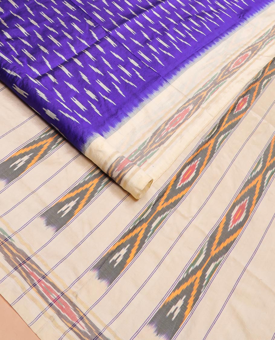 Blue Ikkat Silk Saree with Buttas Across the Body, Highlighted by a Contrast Ikkat-Textured Border, and Pallu Features Stripes and Ikkat Texture