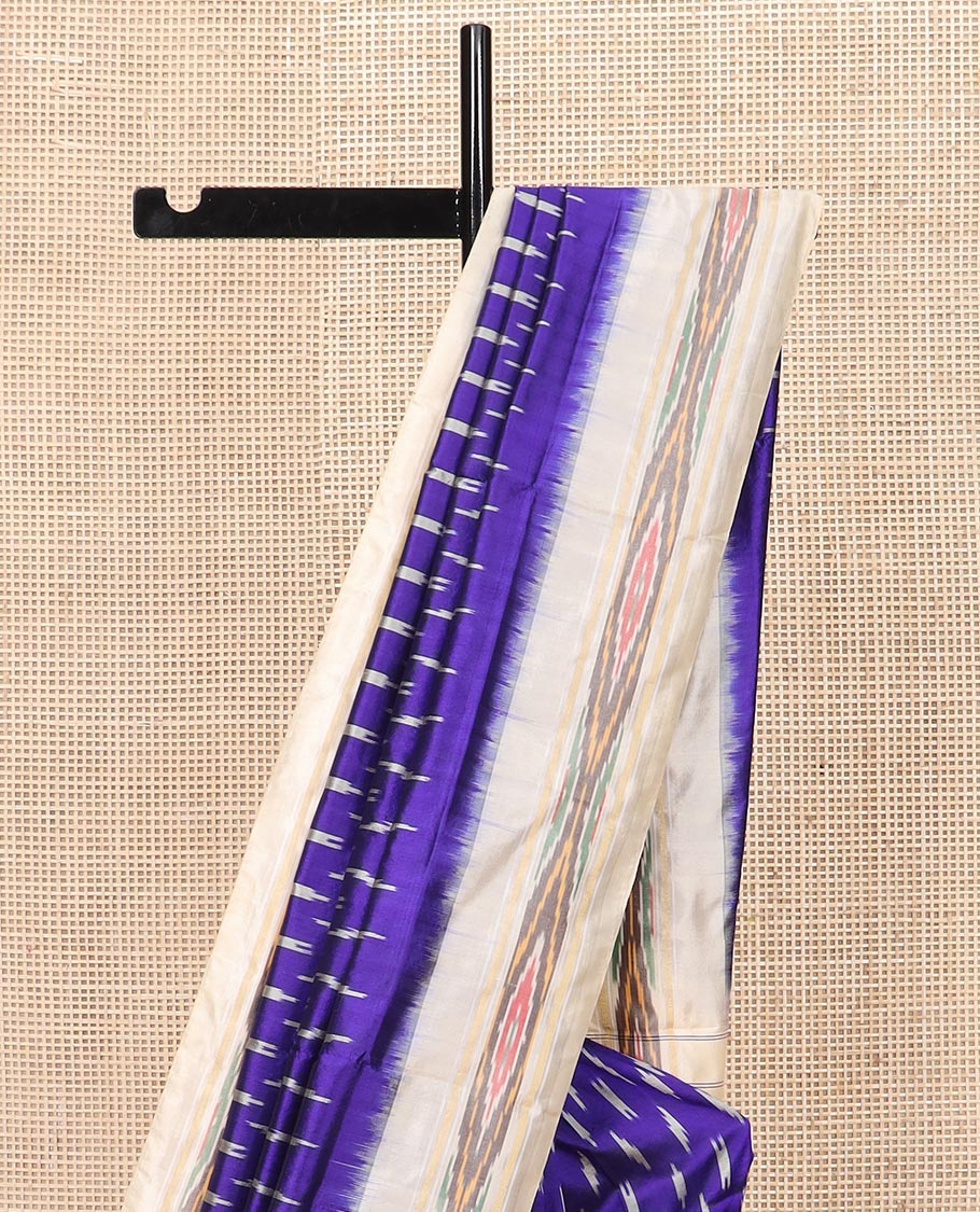 Blue Ikkat Silk Saree with Buttas Across the Body, Highlighted by a Contrast Ikkat-Textured Border, and Pallu Features Stripes and Ikkat Texture