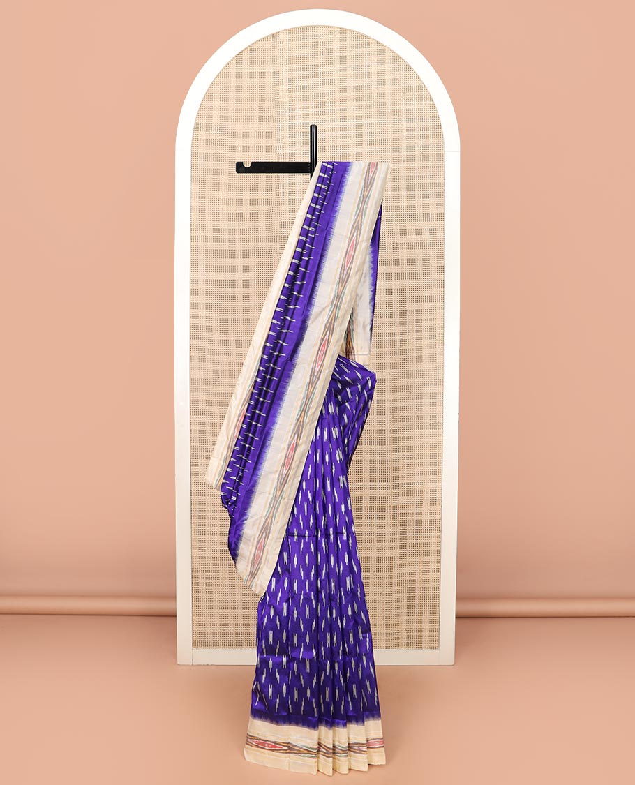 Blue Ikkat Silk Saree with Buttas Across the Body, Highlighted by a Contrast Ikkat-Textured Border, and Pallu Features Stripes and Ikkat Texture