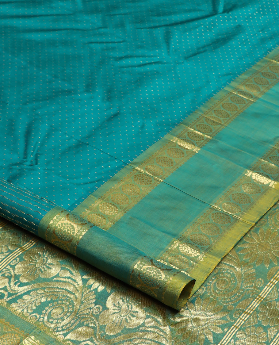 Green zari buttas Kanchipuram silk saree, contrast one-sided rettai pettu border of rekku and poo chakram, and zari design pallu