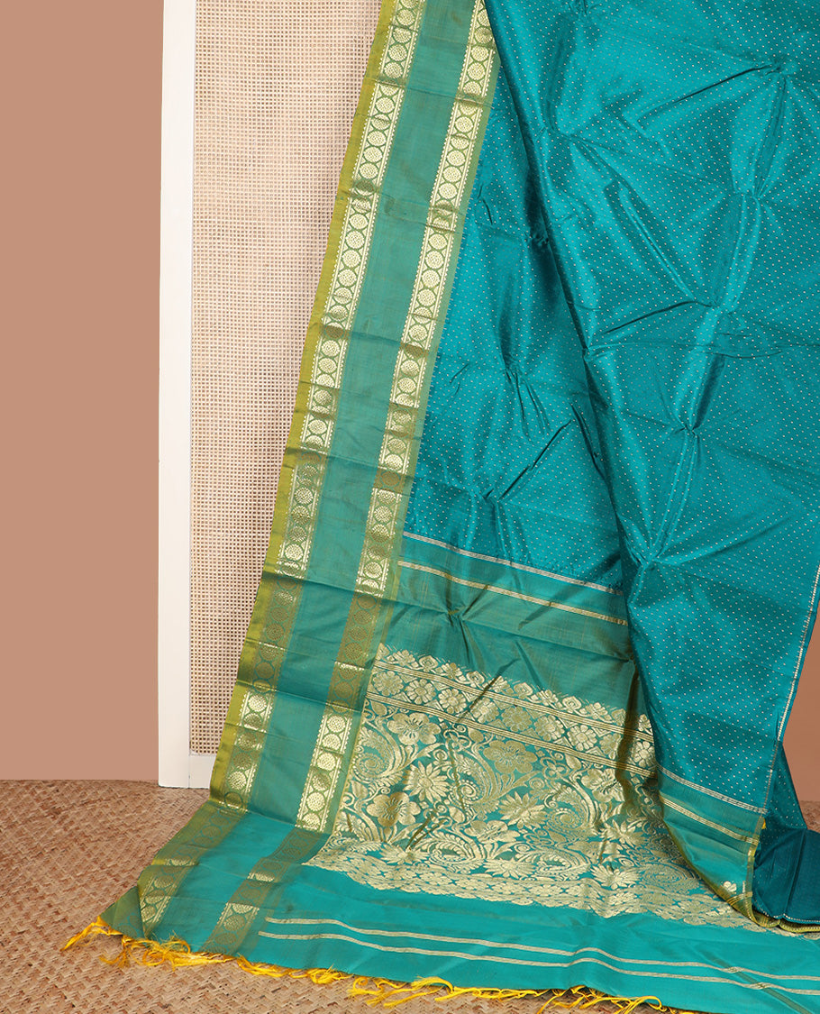 Green zari buttas Kanchipuram silk saree, contrast one-sided rettai pettu border of rekku and poo chakram, and zari design pallu