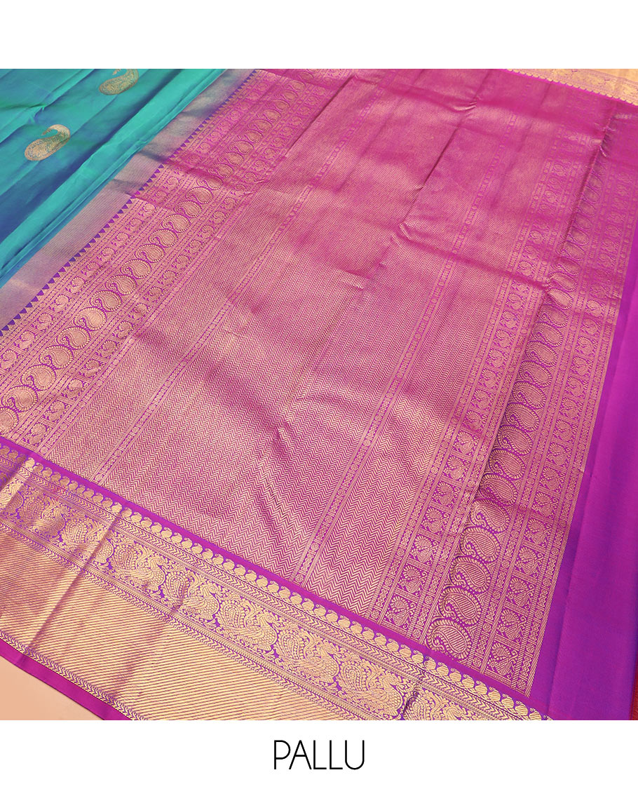 Blue arumbu manga buttas Kanchipuram silk saree, contrast border of manga mokku, muthu, kathir, and mayil designs, and vanki design pallu