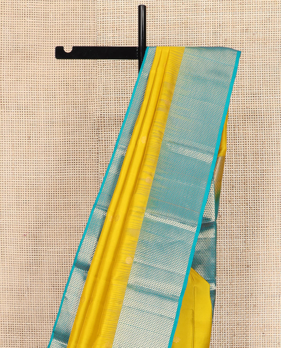 Yellow zari buttas Kanchipuram silk saree, contrast ara maadam design border, and pallu of ara maadam designs