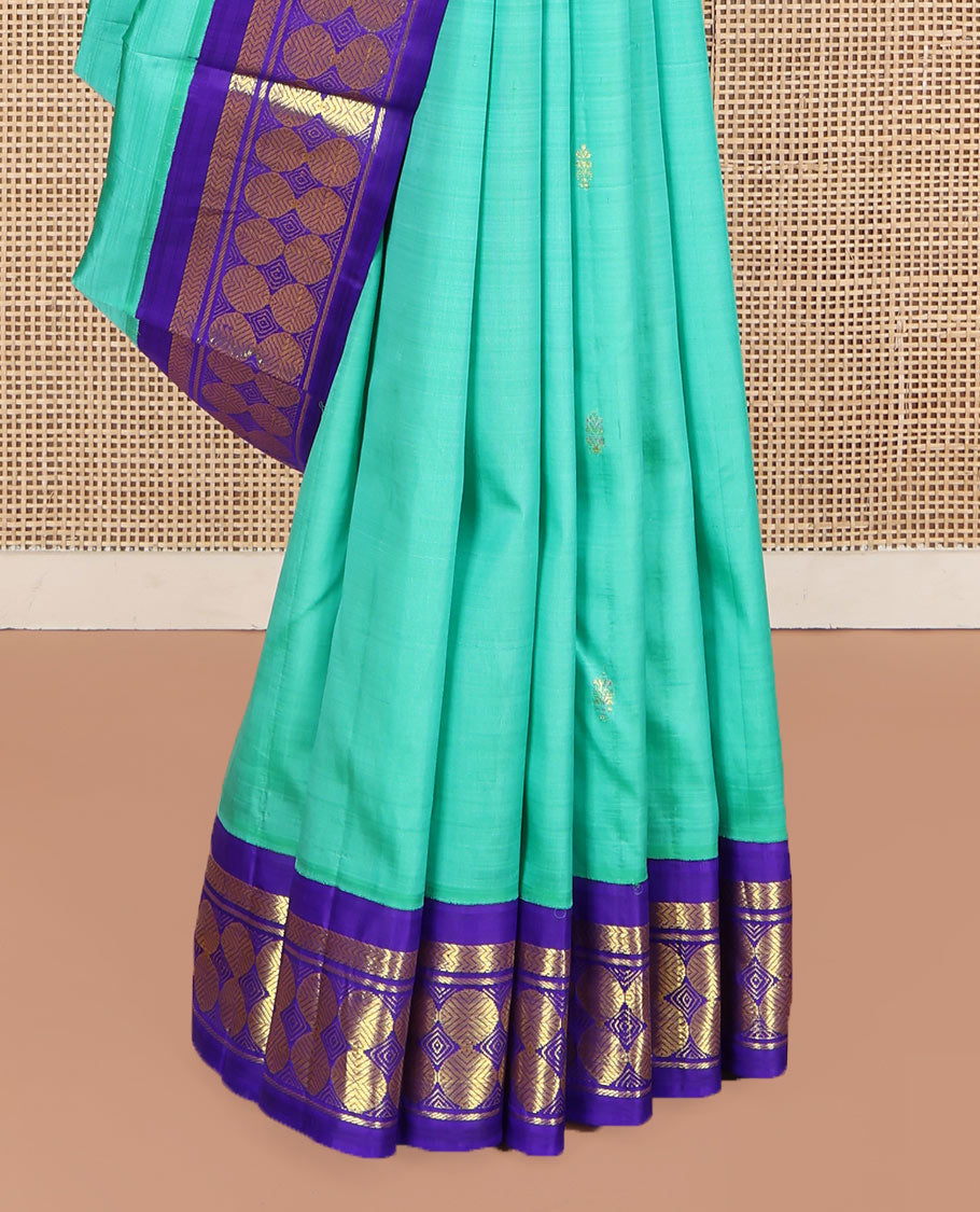 Turquoise Kanchipuram Silk Saree, Beautified with Zari Buttas on Its Body, Complemented by a Contrast One-Sided Korvai Border of Vanki, Banaras, and Rudraksham Designs, Pallu of Zari Designs, and Comes Without a Blouse