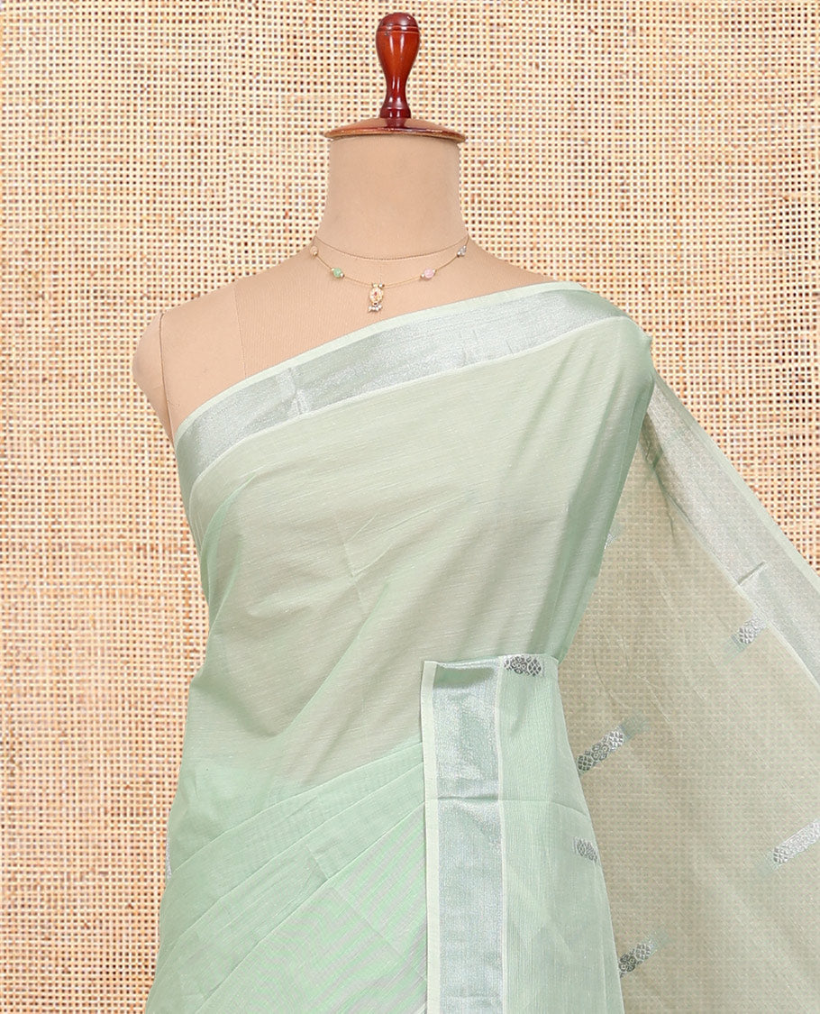 Light Pista Green Kerala Cotton Saree, Highlighted by Buttas All Over Its Body, a Zari Bavanji Border, Pallu of Intricate Designs, and Paired with a Matching Blouse