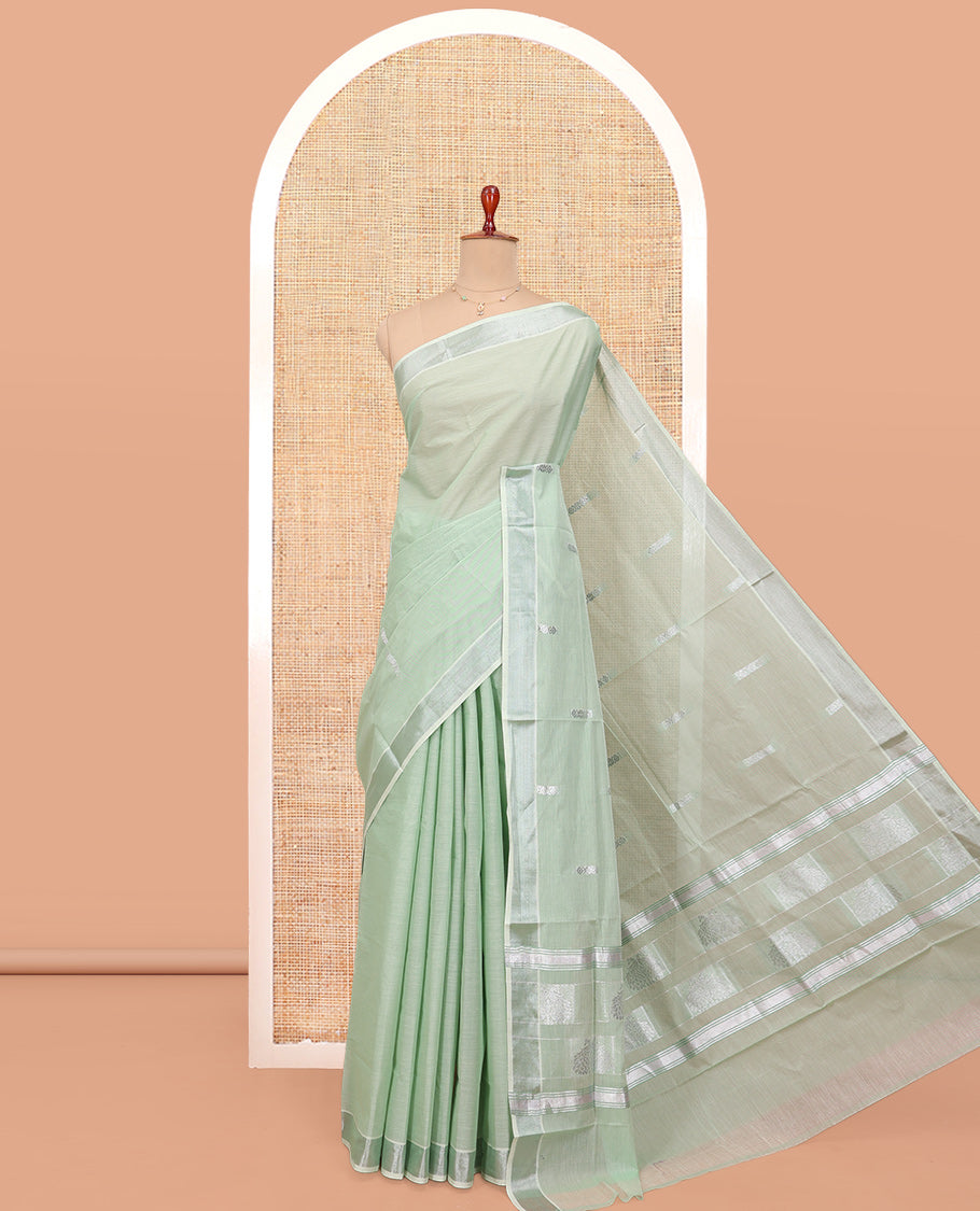 Light Pista Green Kerala Cotton Saree, Highlighted by Buttas All Over Its Body, a Zari Bavanji Border, Pallu of Intricate Designs, and Paired with a Matching Blouse
