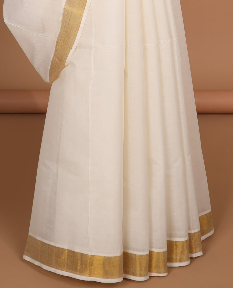 Cream kerala saree with zari designs, plain border & pallu of intricate zari designs