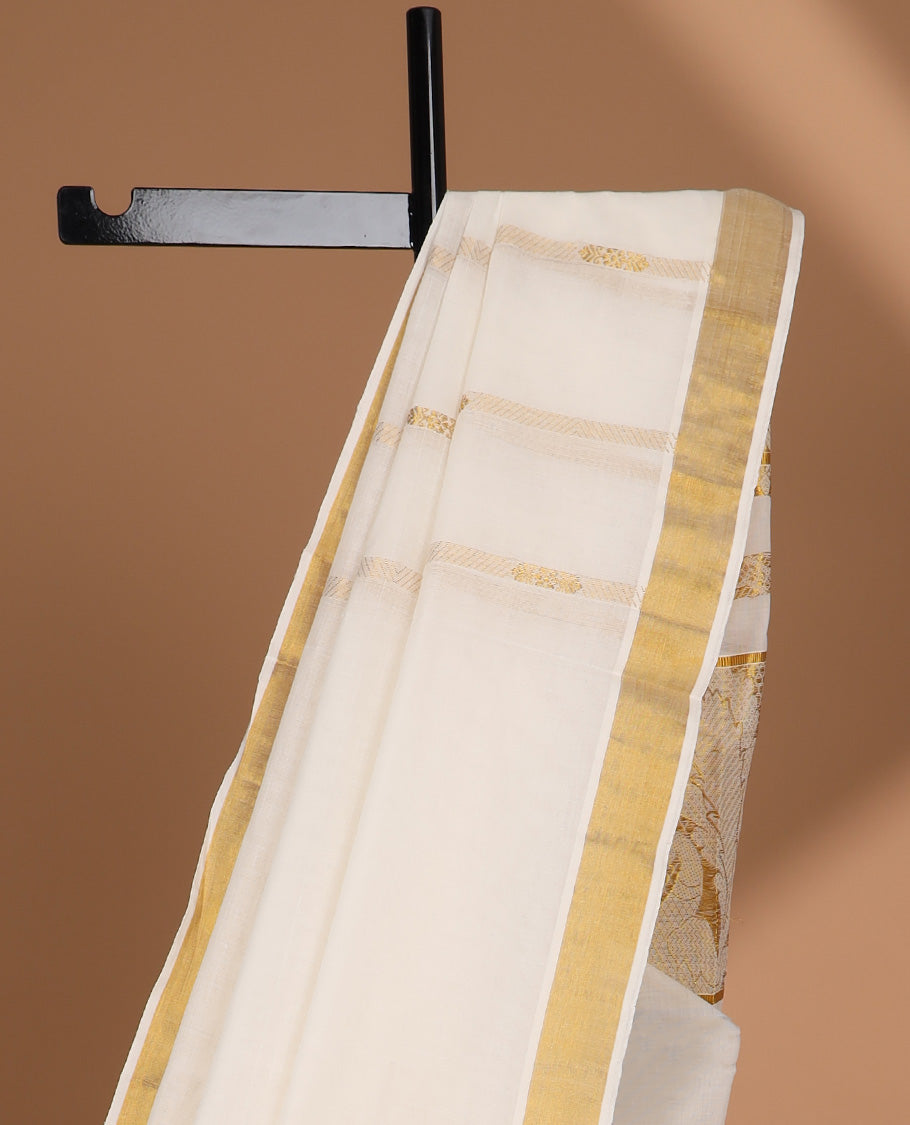 Cream kerala saree with zari designs, plain border & pallu of intricate zari designs