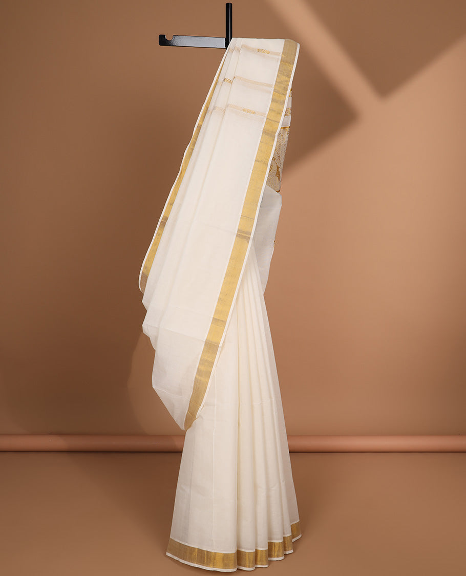 Cream kerala saree with zari designs, plain border & pallu of intricate zari designs