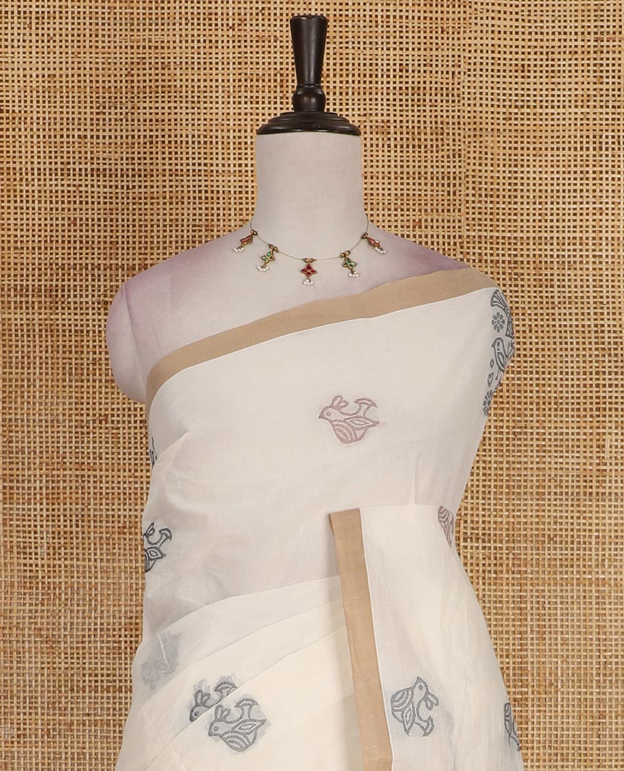 Cream bird motifs printed Handloom cotton saree, contrast piping border, pallu of bird motifs print, and a matching blouse