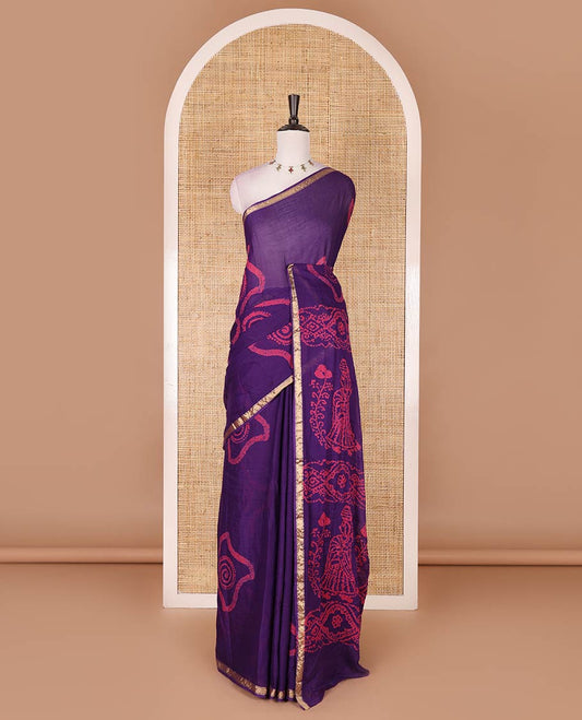 Purple batik geometric printed pure cotton saree, zari piping border, human figurines batik printed pallu, and a matching batik printed blouse