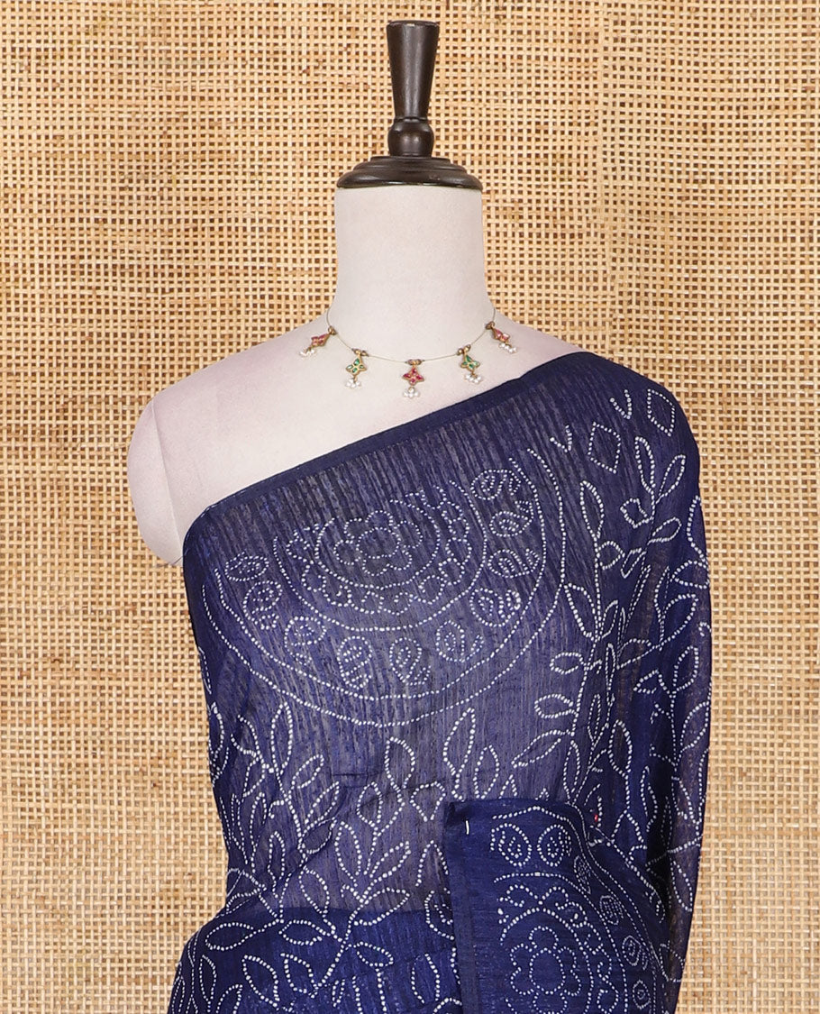 Borderless blue bandhani style floral, paisley, and chakra printed semi-jute silk saree, contrast ajrakh printed pallu, and ajrakh printed blouse
