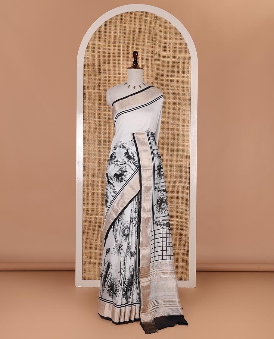 White sunflower floral printed assam cotton saree, zari border of traditional motifs, striped pallu, and contrast blouse