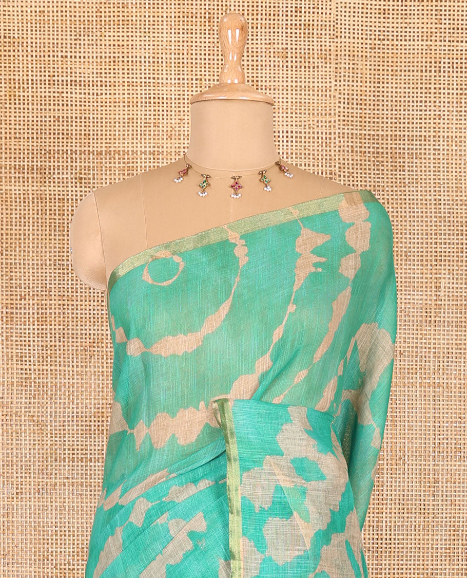 Borderless green batik printed linen cotton saree, hand brush painting style floral vine printed pallu, and contrast floral printed blouse