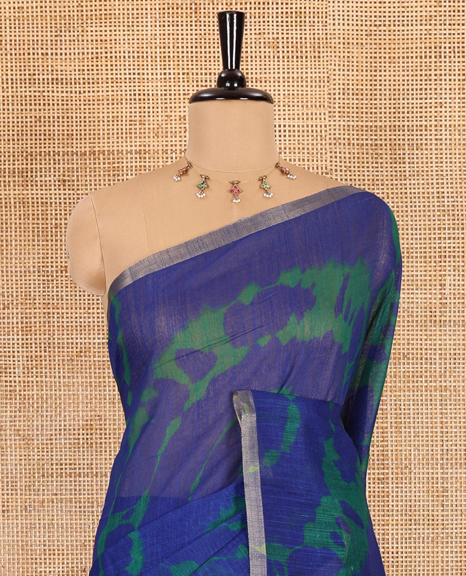 Borderless blue big circle shibori printed linen cotton saree, contrast sanganeri floral block printed pallu, and a contrast printed blouse