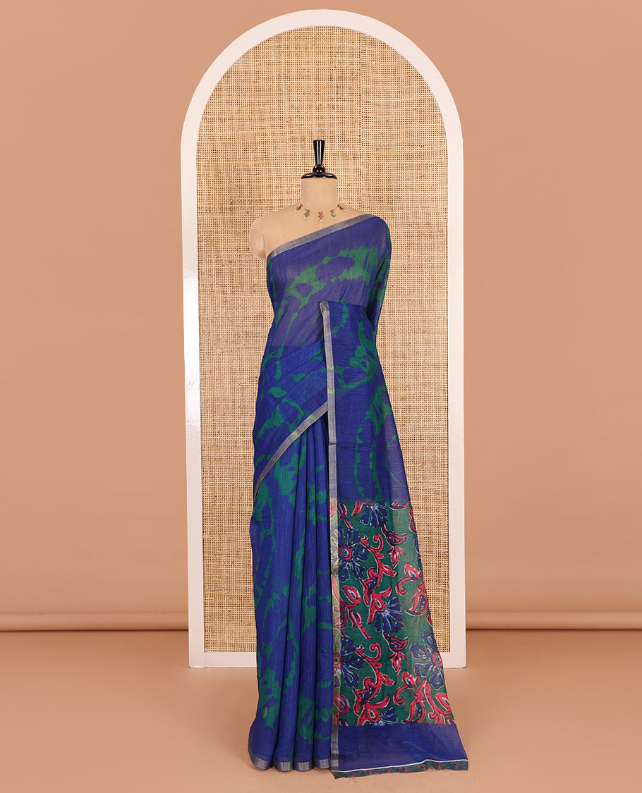 Borderless blue big circle shibori printed linen cotton saree, contrast sanganeri floral block printed pallu, and a contrast printed blouse