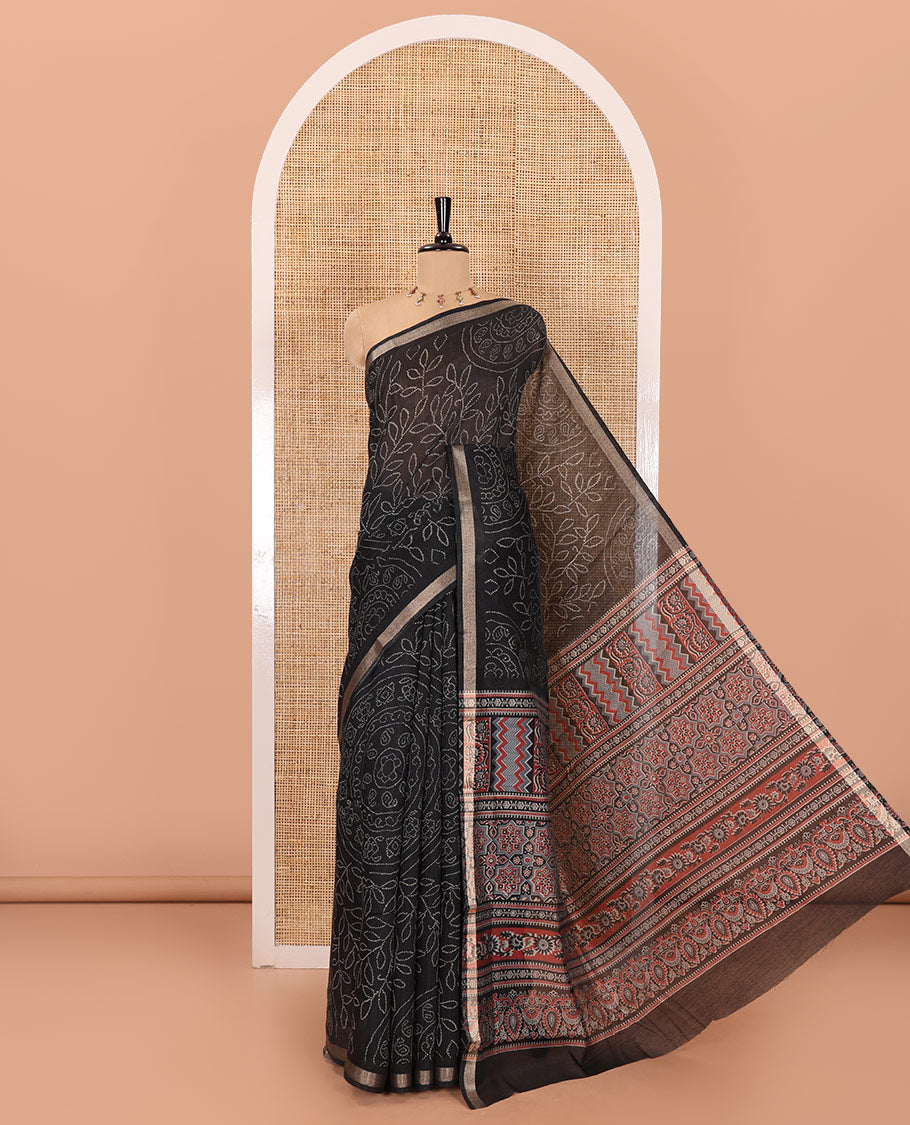 Black bandhani-style floral and chakra printed saree, zari piping border, contrast ajrakh printed pallu, and contrast ajrakh printed blouse