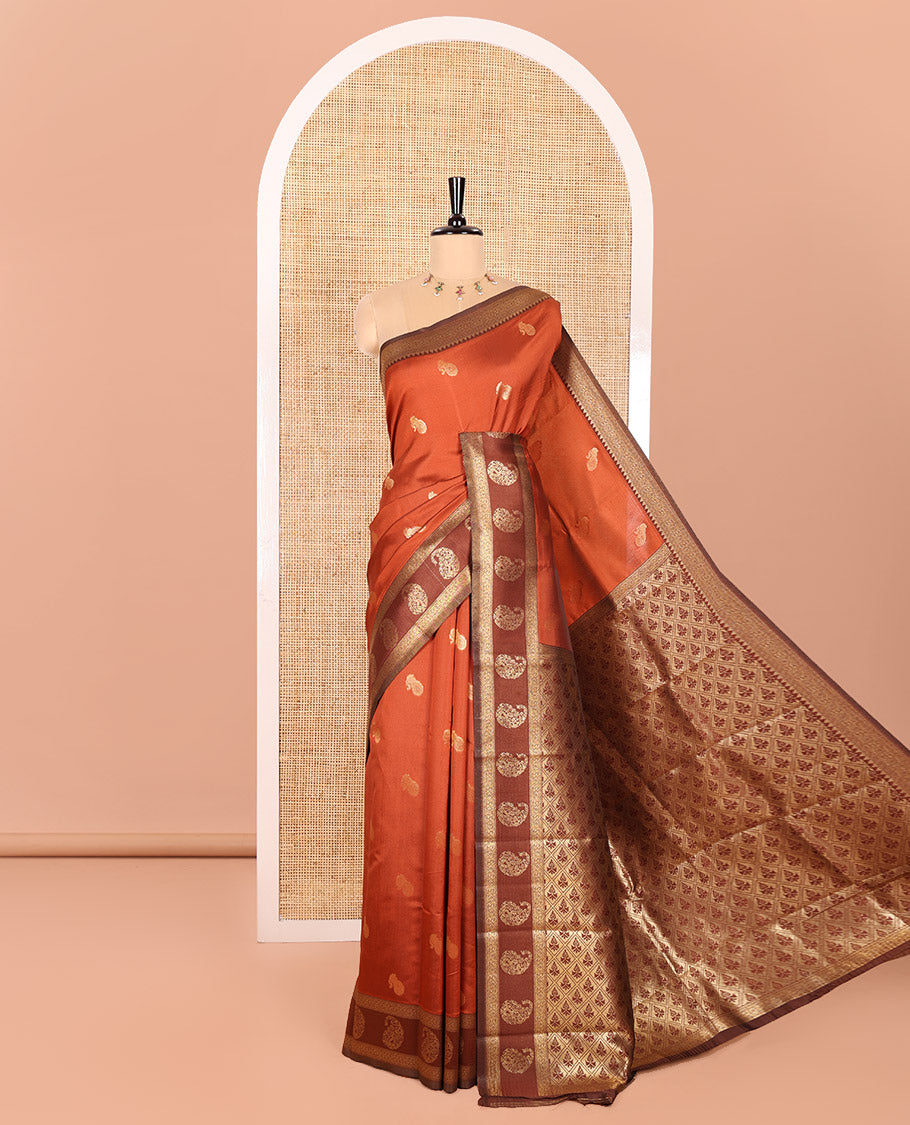Rust Orange Kanchi Silk Saree, Accentuated with Paisley Zari Buttas All Over Its Body, Complemented by a Contrast Border of Floral and Paisley Designs, Grand Pallu of Jaal Design, and Paired with a Contrast Blouse