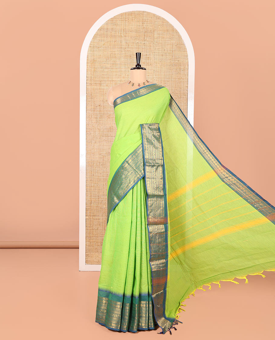Parrot Green Plain Chettinad Cotton Saree, Complemented by Contrast Border Steeped with Traditional Zari Designs, Subtly Striped Pallu, and Paired with a Matching Blouse