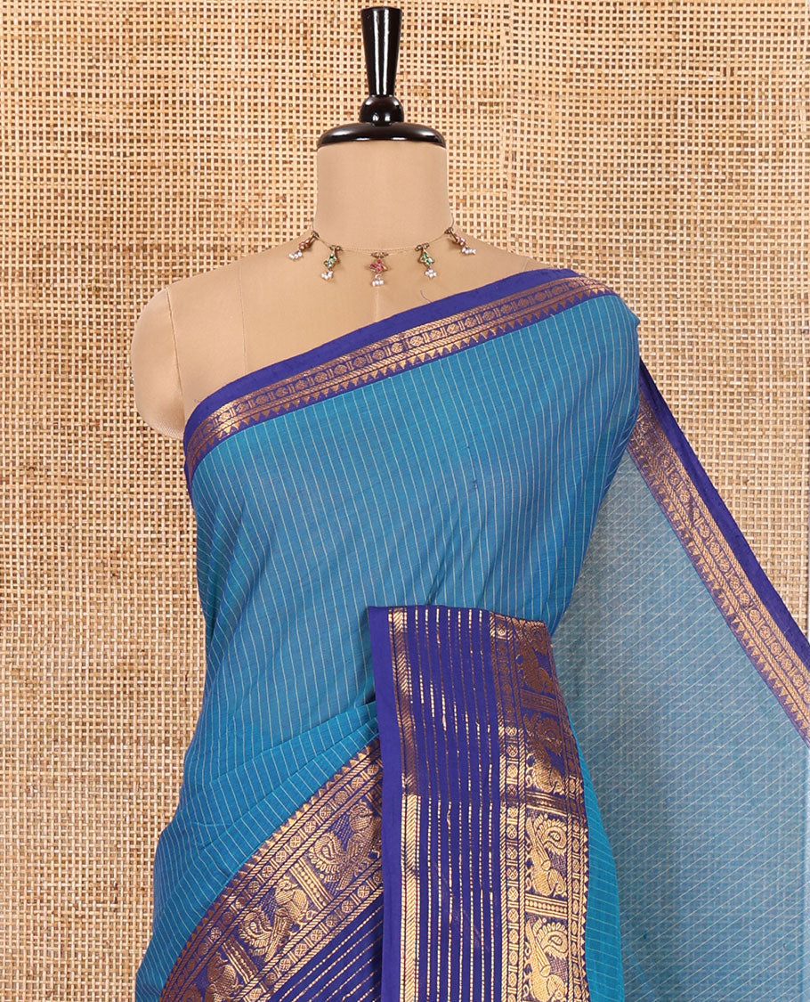 Blue Chettinad Cotton Saree, Sparkled with Vertical Stripes on Its Body, Complemented by a Contrast Traditional Zari Border of Peacock Designs, Subtly Striped Pallu, and Paired with a Matching Blouse