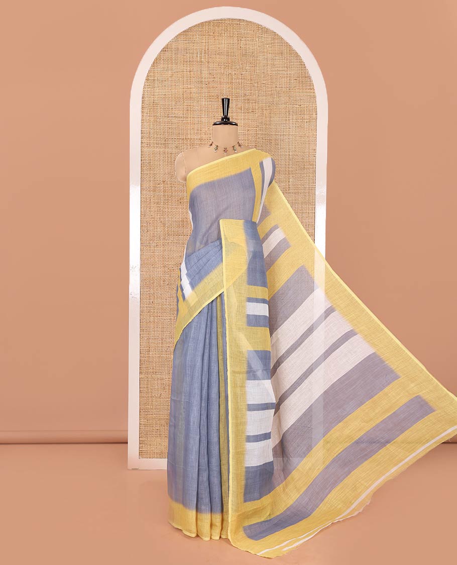 Grey Linen Saree, Subtly Sparkled with Stripes on Its Body, Complemented by a Contrast Border, Subtly Striped Pallu, and Comes with a Contrast Blouse