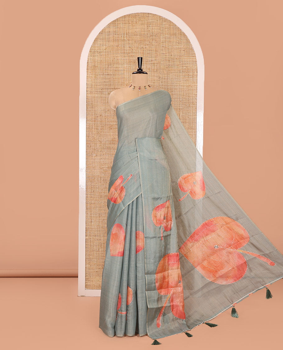 Borderless Green Tissue Saree, Spotlighted with Big Leaf Motifs Print, and Outline Embroidery All Over the Saree, Paired with a Subtle Leaf Motifs Printed Blouse