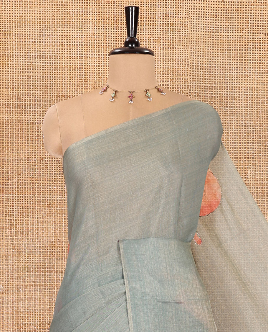 Borderless Green Tissue Saree, Spotlighted with Big Leaf Motifs Print, and Outline Embroidery All Over the Saree, Paired with a Subtle Leaf Motifs Printed Blouse