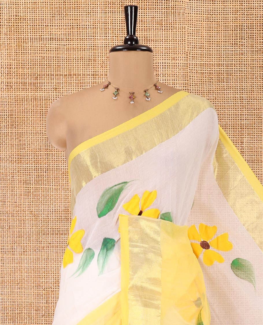 Cream and Yellow Khadi Mul Cotton Saree, Adorned with Hand-Brush Painting-Style Floral Block Printed Body, a Subtle Gold Zari Border, a Self-Pallu, and Paired with a Matching Blouse